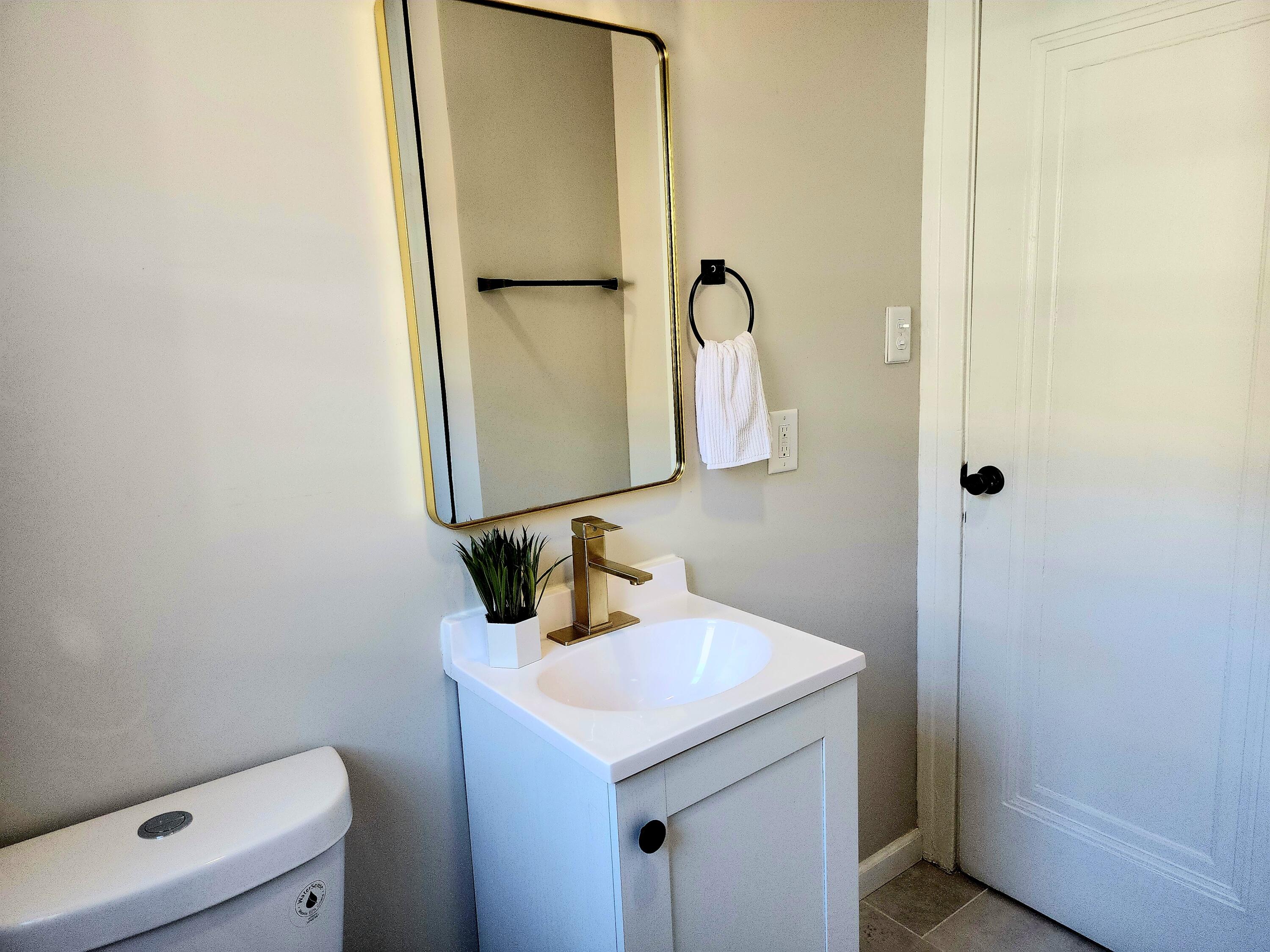 418 Taft Street Gary, IN 46404 - Photo 14 of 18 a bathroom with a sink and a mirror