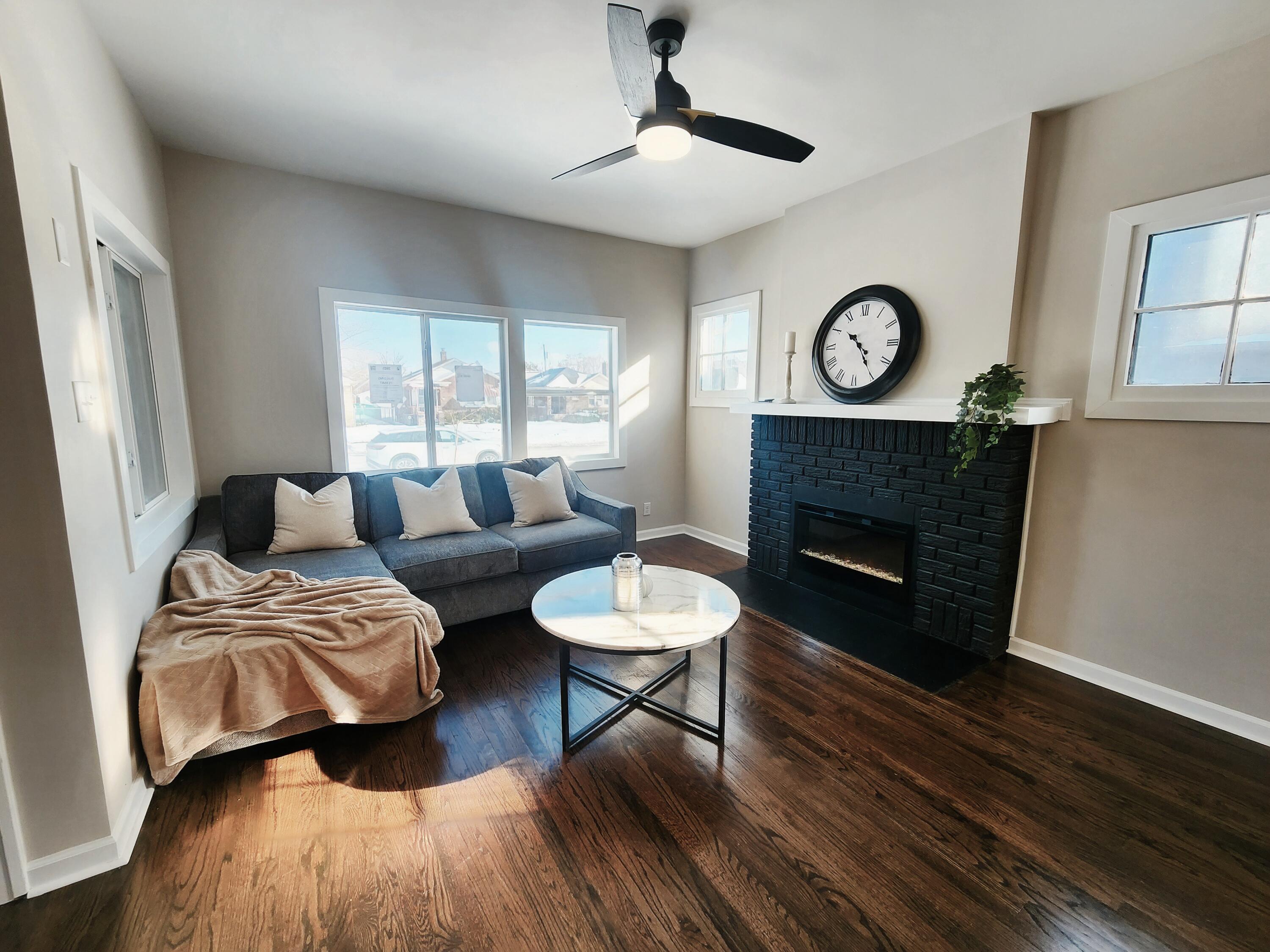 418 Taft Street Gary, IN 46404 - Photo 4 of 18 a bedroom with furniture and a fireplace