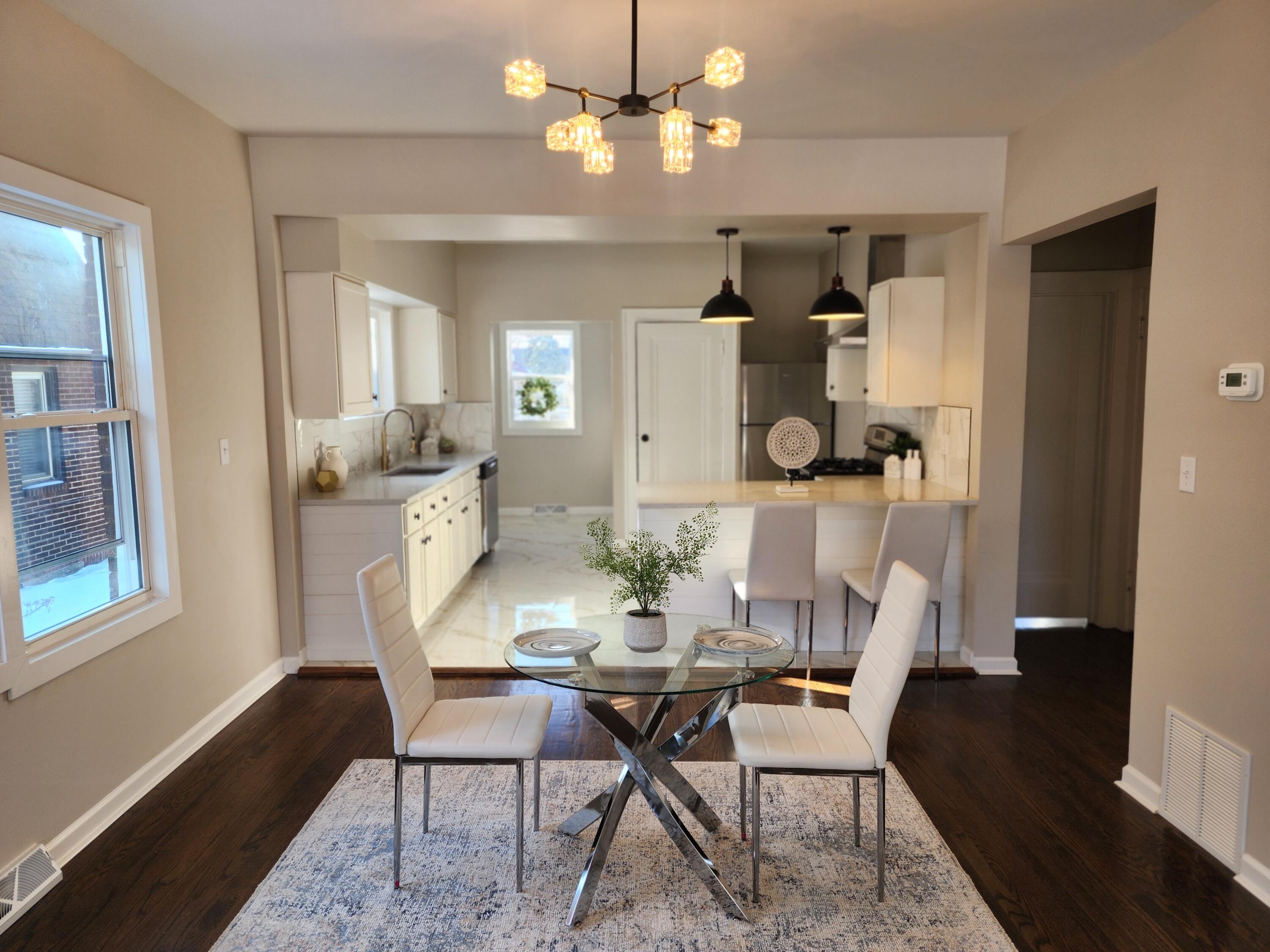 418 Taft Street Gary, IN 46404 - Photo 7 of 18 a view of a dining room with furniture and a chandelier