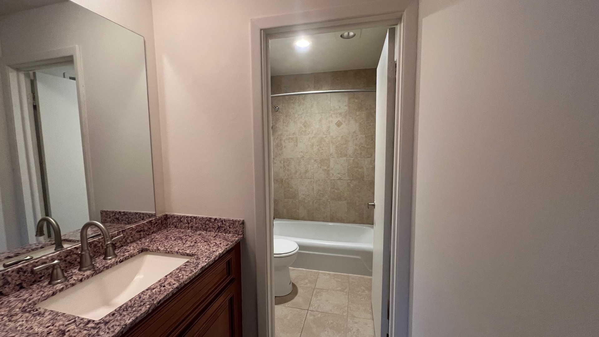 850 South Lorraine Road, Unit 3L Wheaton, IL 60189 - Photo 12 of 19 a bathroom with a granite countertop sink and a mirror
