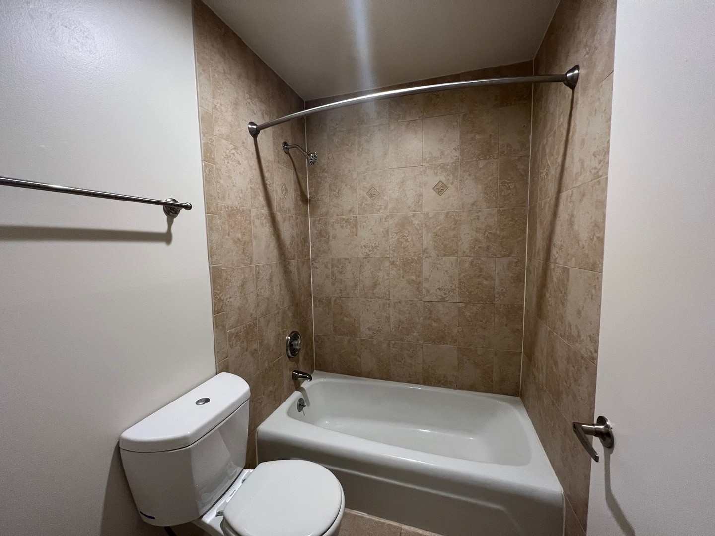 850 South Lorraine Road, Unit 3L Wheaton, IL 60189 - Photo 13 of 19 a bathroom with a toilet and a shower