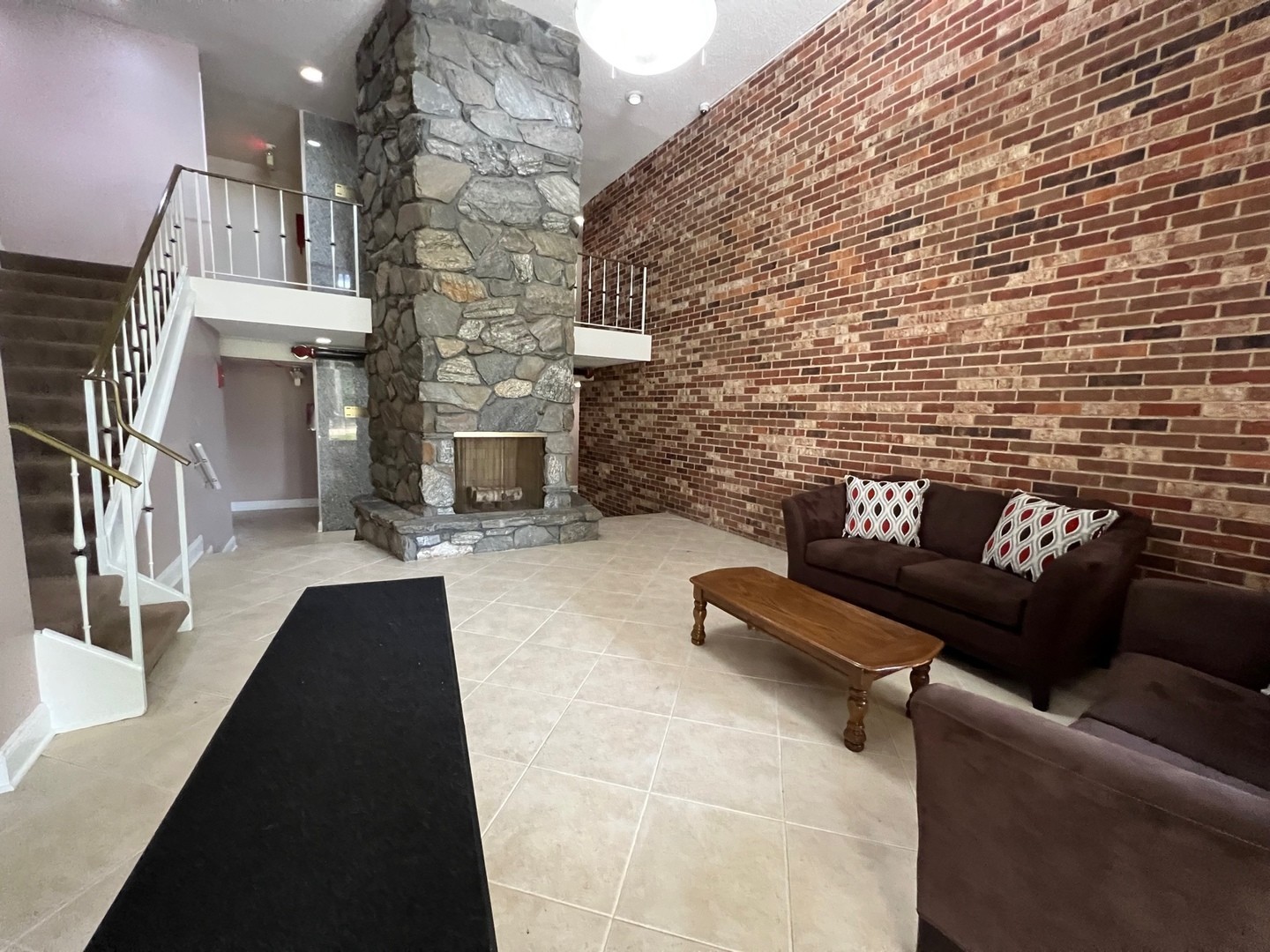 850 South Lorraine Road, Unit 3L Wheaton, IL 60189 - Photo 3 of 19 a living room with furniture and a fireplace