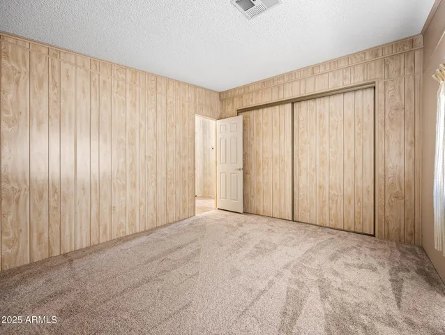 wooden floor in an empty room and a window
