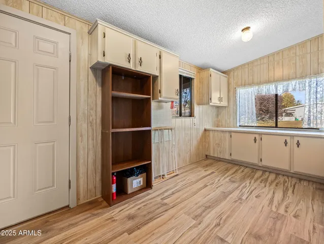 a kitchen with stainless steel appliances a refrigerator and a stove top oven