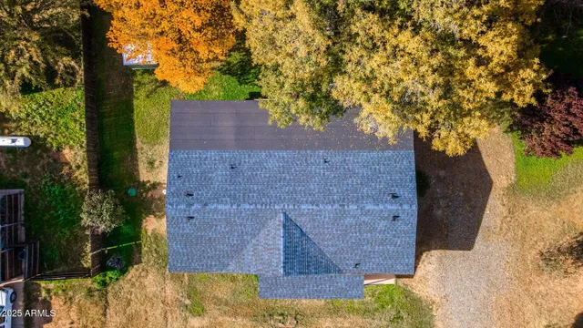 a aerial view of a house with a yard