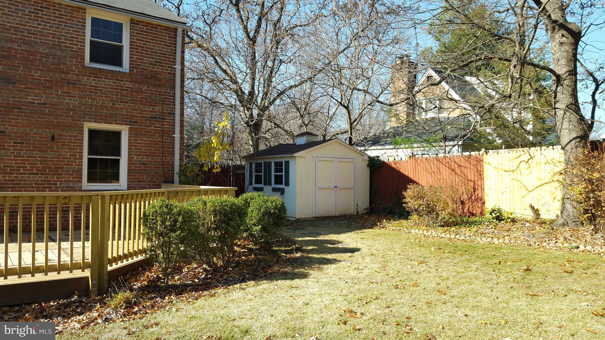 9011 Eton Road Silver Spring, MD 20901 - Photo 13 of 13 a view of a yard with plants and wooden fence