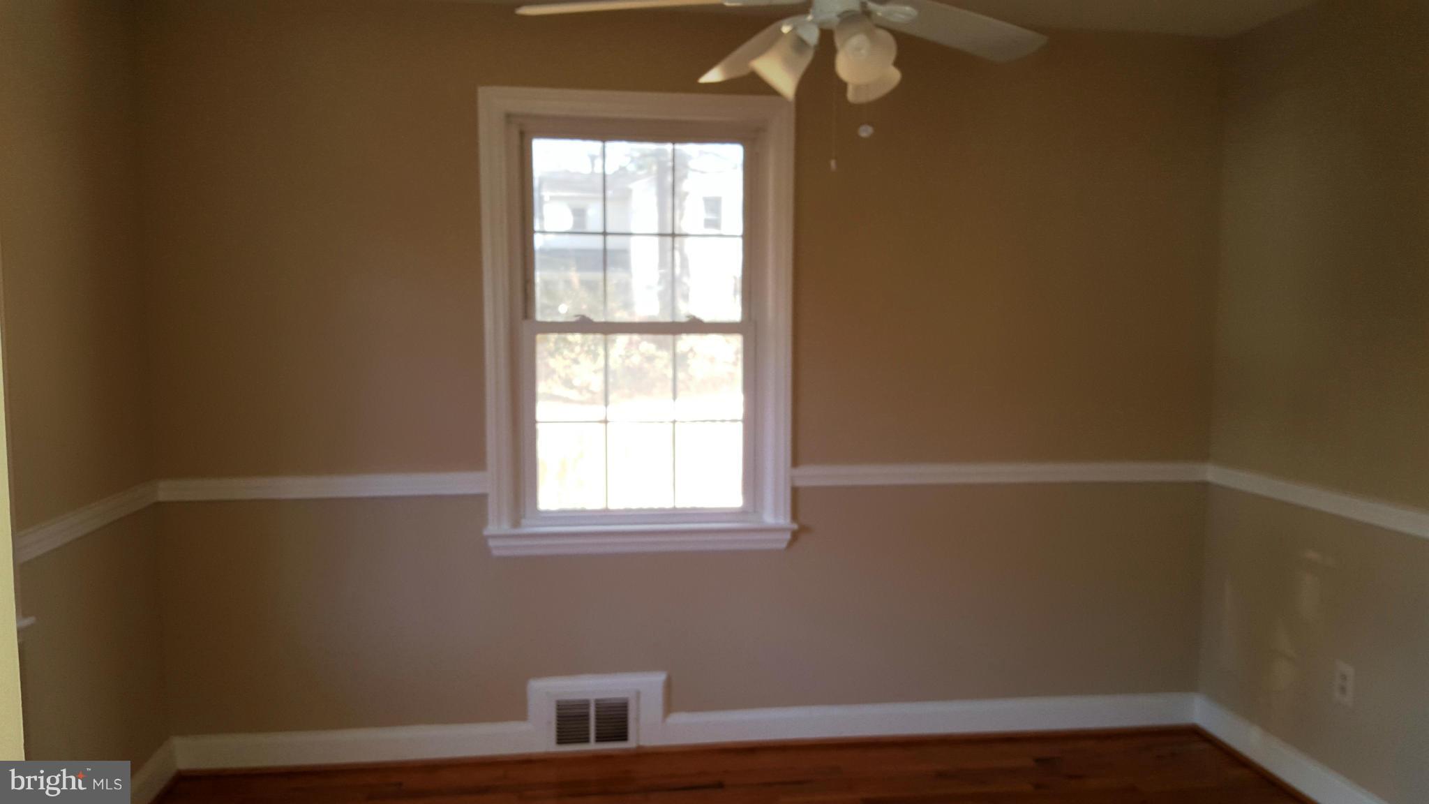9011 Eton Road Silver Spring, MD 20901 - Photo 3 of 13 an empty room with a window