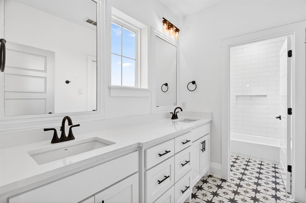 7798 Barber Rnch Road Fort Worth, TX 76126 - Photo 35 of 40 a bathroom with a sink a toilet and shower