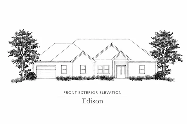 a large white building with a large tree