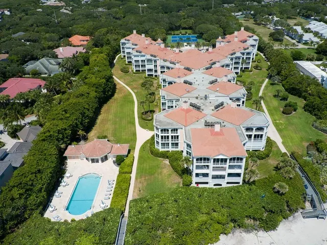 an aerial view of house with yard