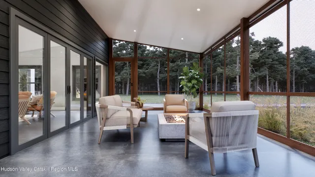 a outdoor space with patio couch and wooden floor