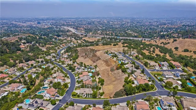 an aerial view of city and lake