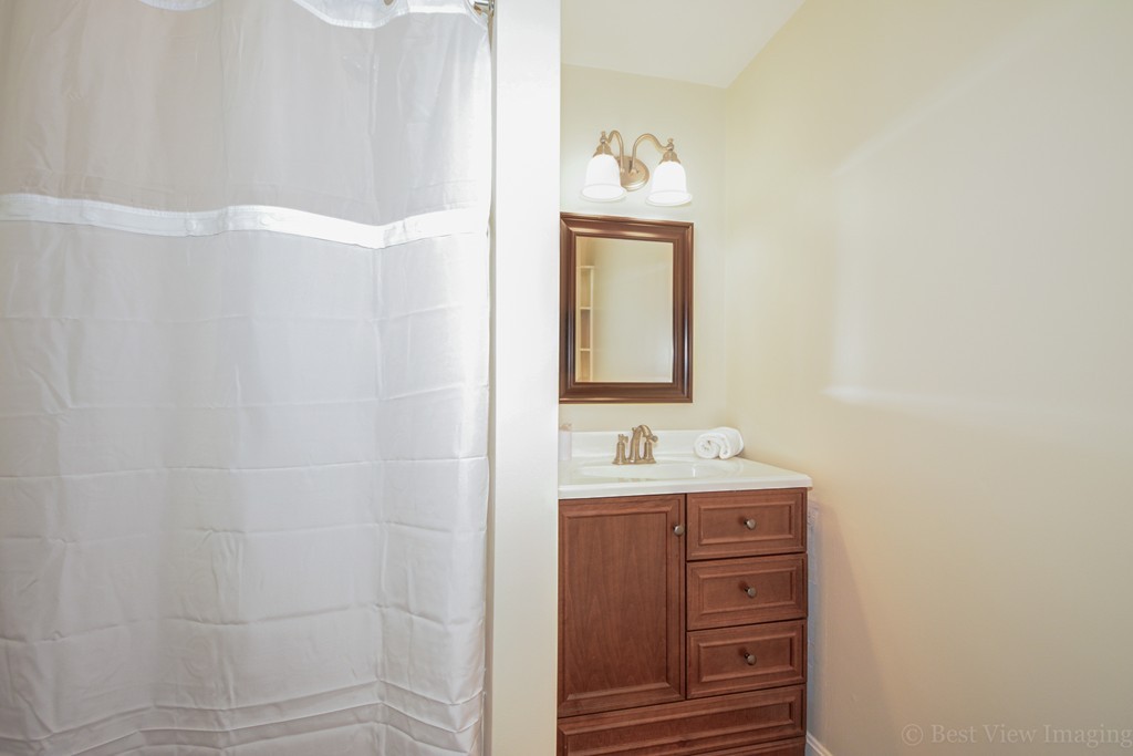 3 Forest Road Stow, MA 01775 - Photo 8 of 19 a bathroom with a sink a toilet and a mirror