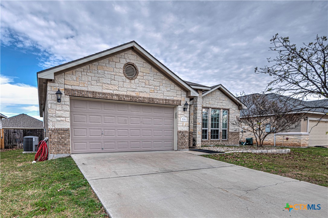 504 Coventry Drive Temple, TX 76502 - Photo 2 of 30 a front view of a house with a yard