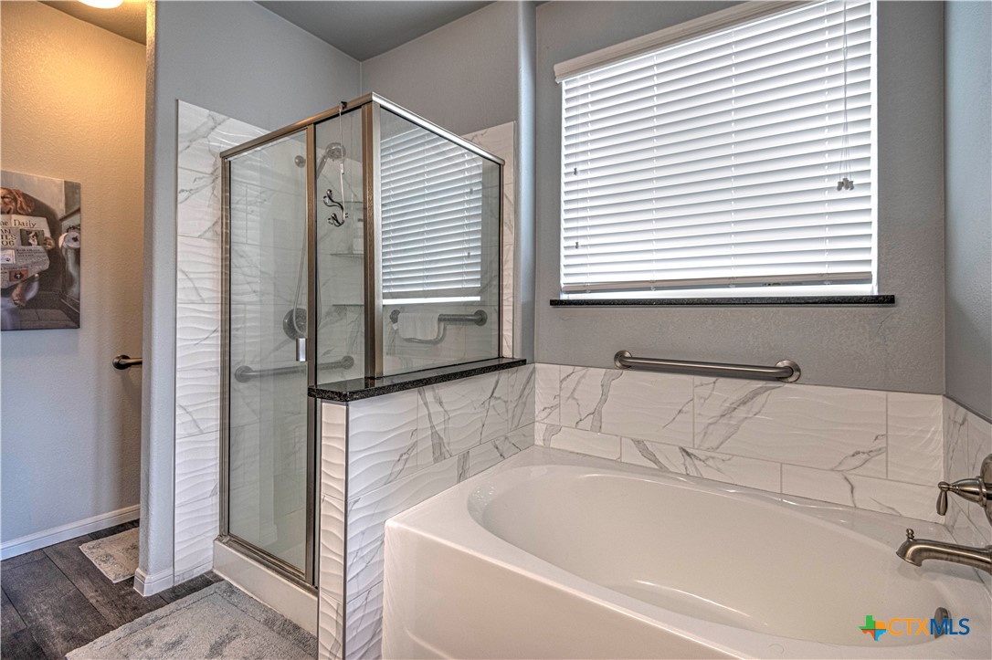 504 Coventry Drive Temple, TX 76502 - Photo 25 of 30 a bathroom with a bathtub and a shower