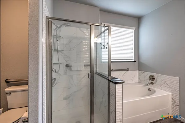 a bathroom with a sink a mirror and a bathtub
