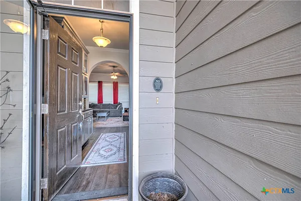a view of hallway with livingroom