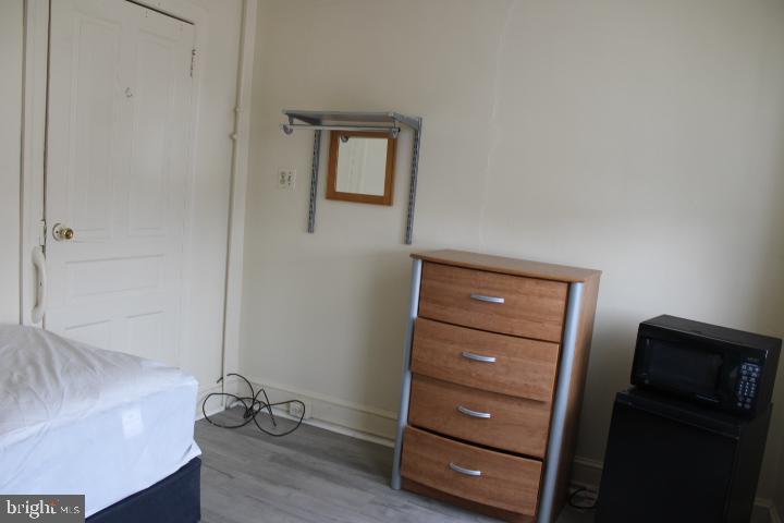 1241 North George Street, Unit 3 York, PA 17404 - Photo 3 of 6 a view of a dresser in the room