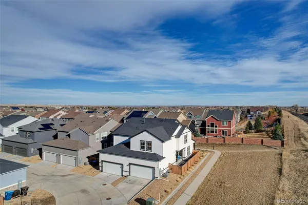 an aerial view of a house with a garden