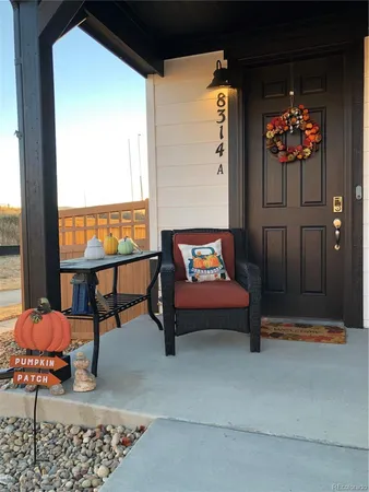 a outdoor living space with furniture and a potted plant