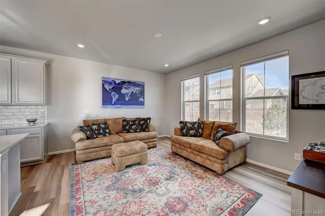 a living room with furniture and a rug