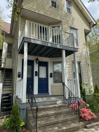 a front view of a house with a porch