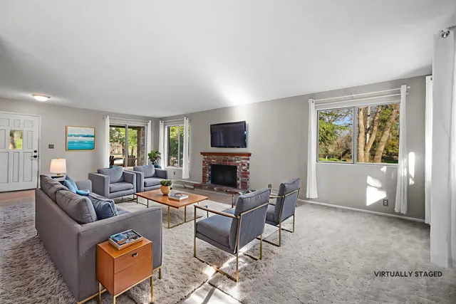 a spacious bathroom with a granite countertop sink and a mirror