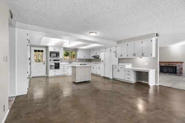 a view of a park with large trees