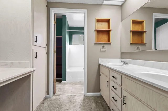 a view of a house with a yard and sitting area