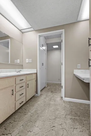 a view of swimming pool and trees in the background