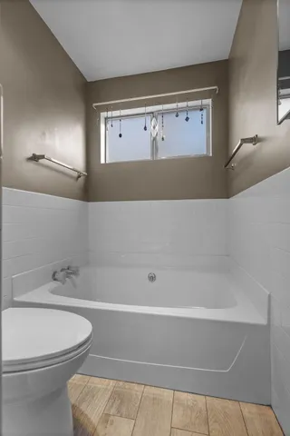 a view of a house with a yard and garage