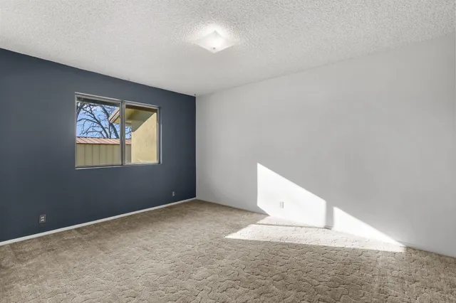 a front view of a house with a yard table and chairs