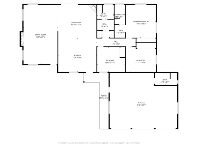 an empty room with windows and fireplace