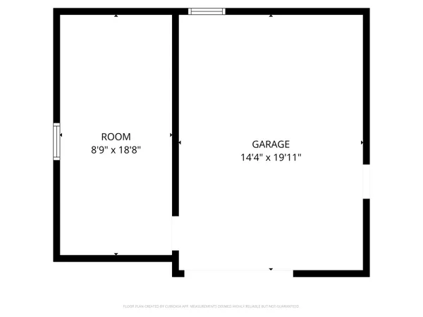 an empty room with windows and fireplace