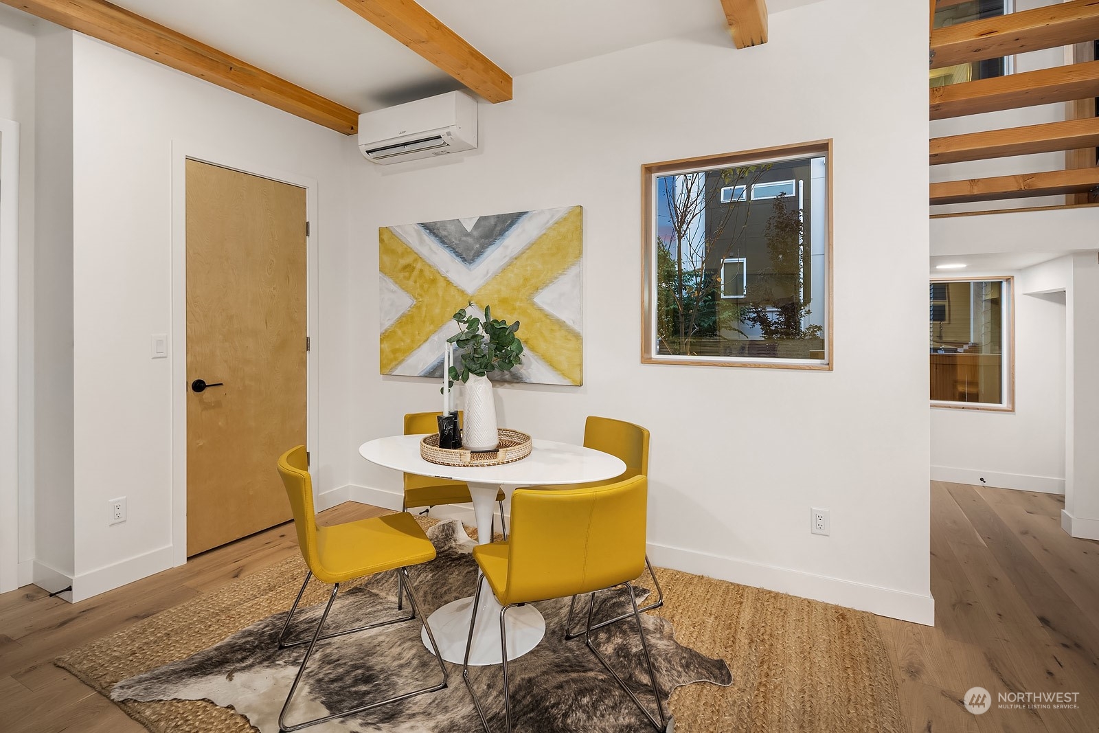 911 14th Avenue, Unit A Seattle, WA 98122 - Photo 11 of 33 a view of a dining room with furniture and wooden floor