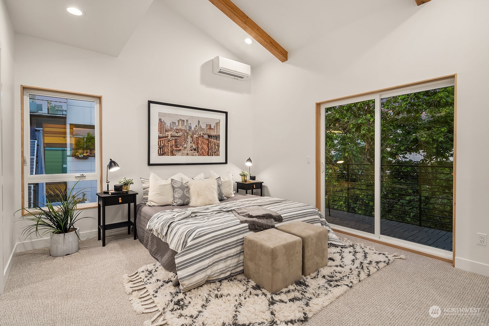 911 14th Avenue, Unit A Seattle, WA 98122 - Photo 16 of 33 a bedroom with a large bed and a potted plant