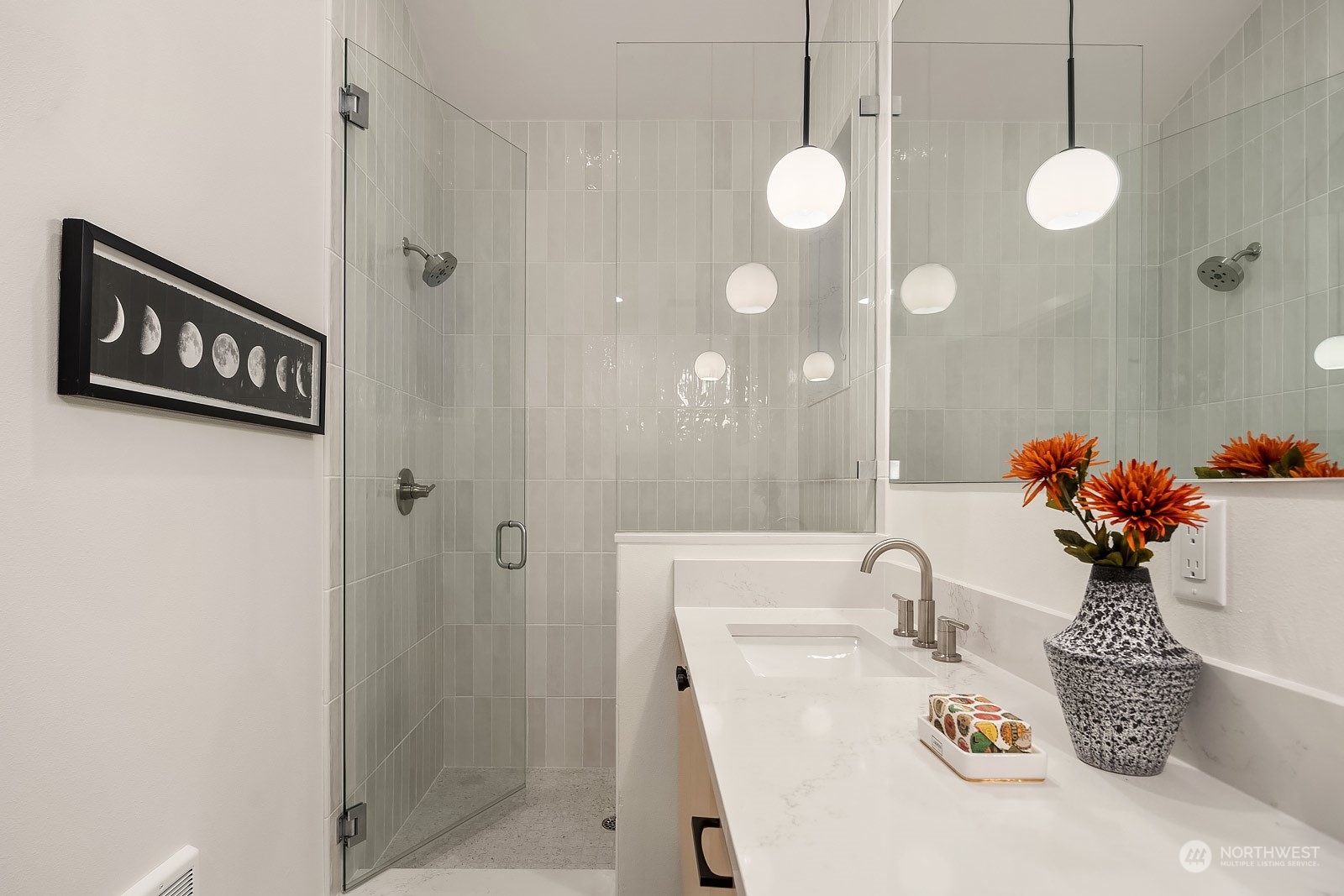 911 14th Avenue, Unit A Seattle, WA 98122 - Photo 19 of 33 a bathroom with a sink and a mirror
