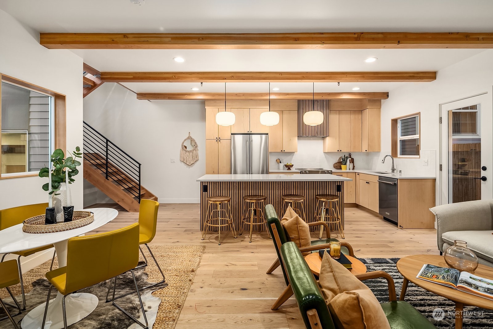 911 14th Avenue, Unit A Seattle, WA 98122 - Photo 2 of 33 a dining hall with stainless steel appliances kitchen island granite countertop a dining table chairs and mirrors
