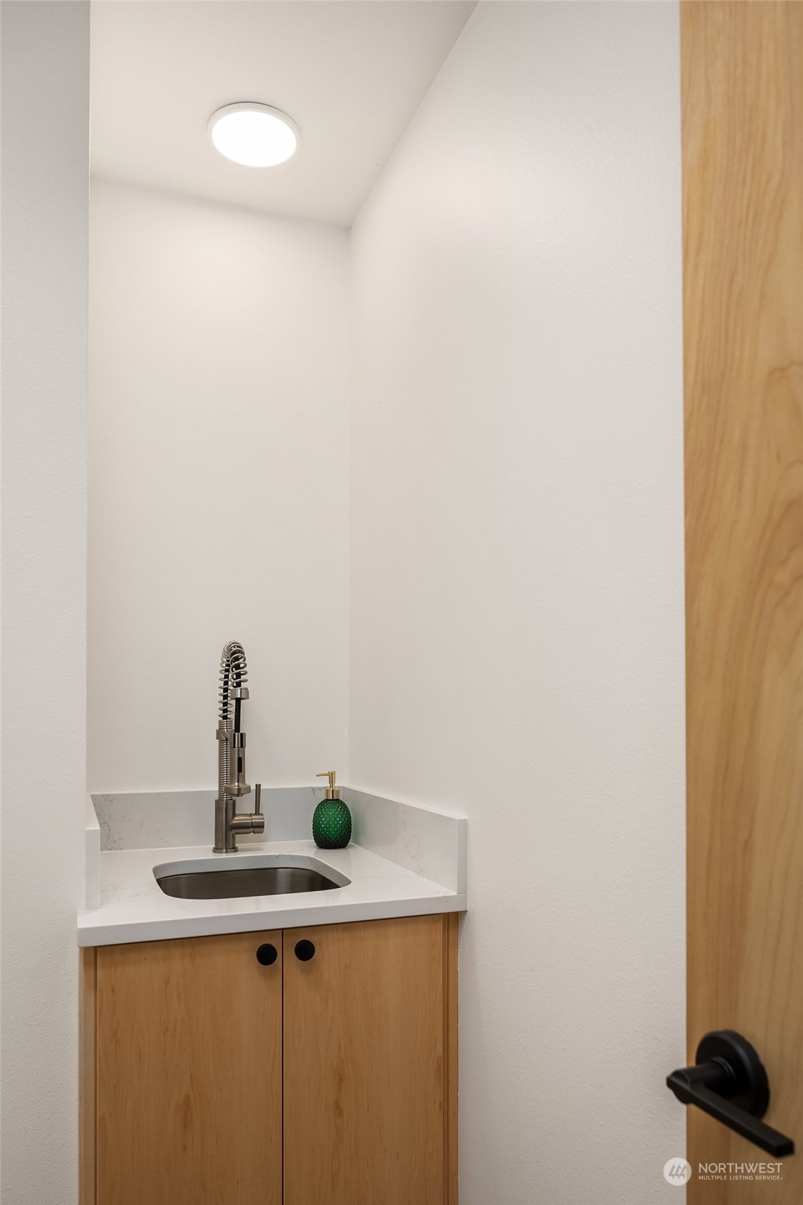 911 14th Avenue, Unit A Seattle, WA 98122 - Photo 24 of 33 a kitchen with a sink and cabinets