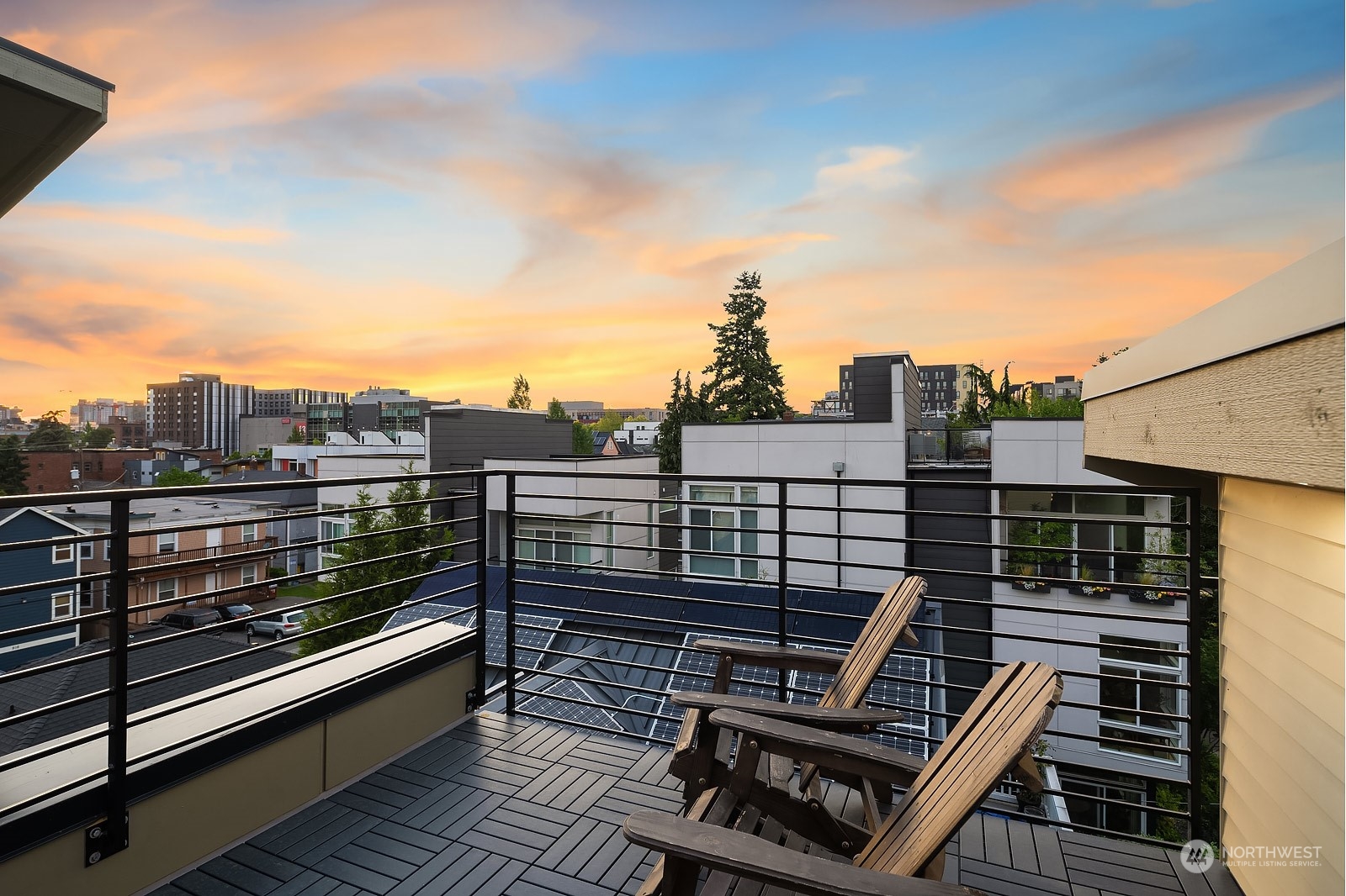 911 14th Avenue, Unit A Seattle, WA 98122 - Photo 27 of 33 a view of a roof deck with two couches and wooden floor