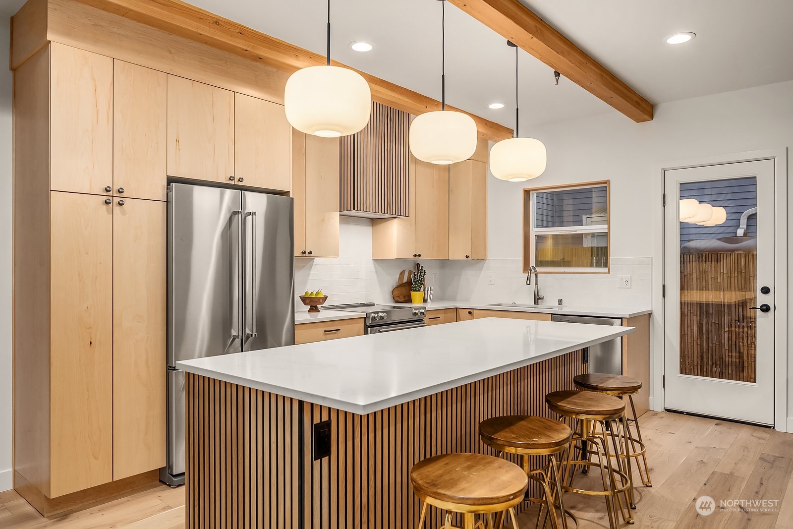 911 14th Avenue, Unit A Seattle, WA 98122 - Photo 5 of 33 a kitchen with a table and chairs in it