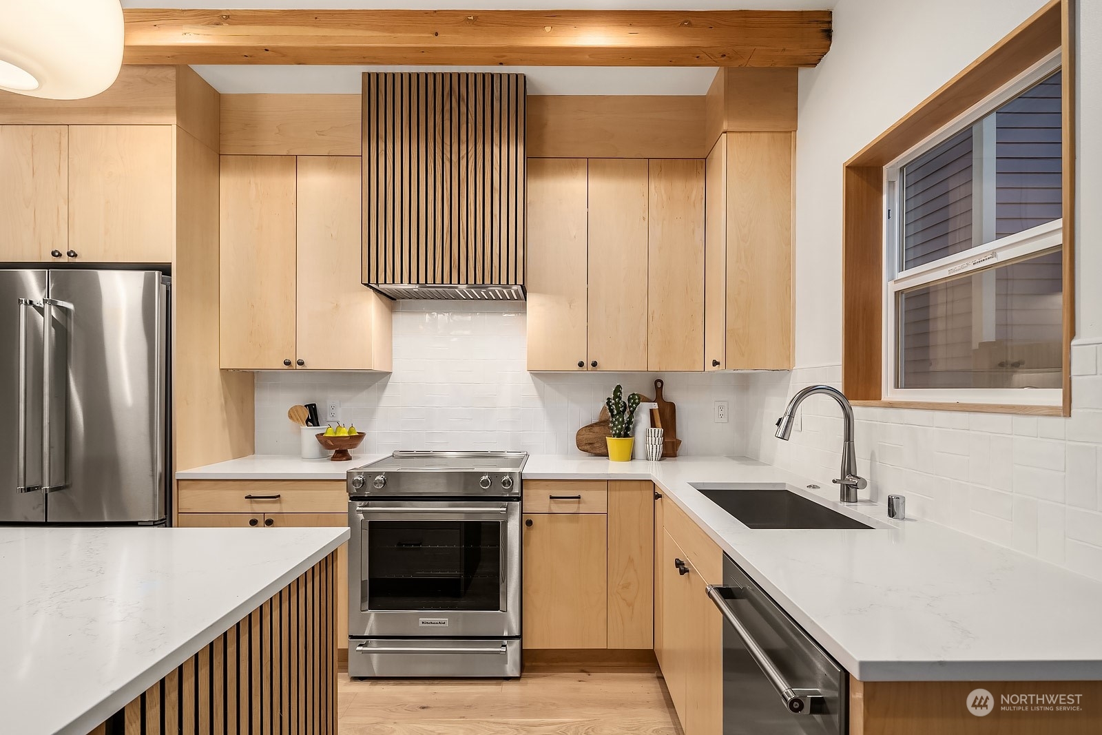 911 14th Avenue, Unit A Seattle, WA 98122 - Photo 7 of 33 a kitchen with stainless steel appliances granite countertop a sink stove and refrigerator