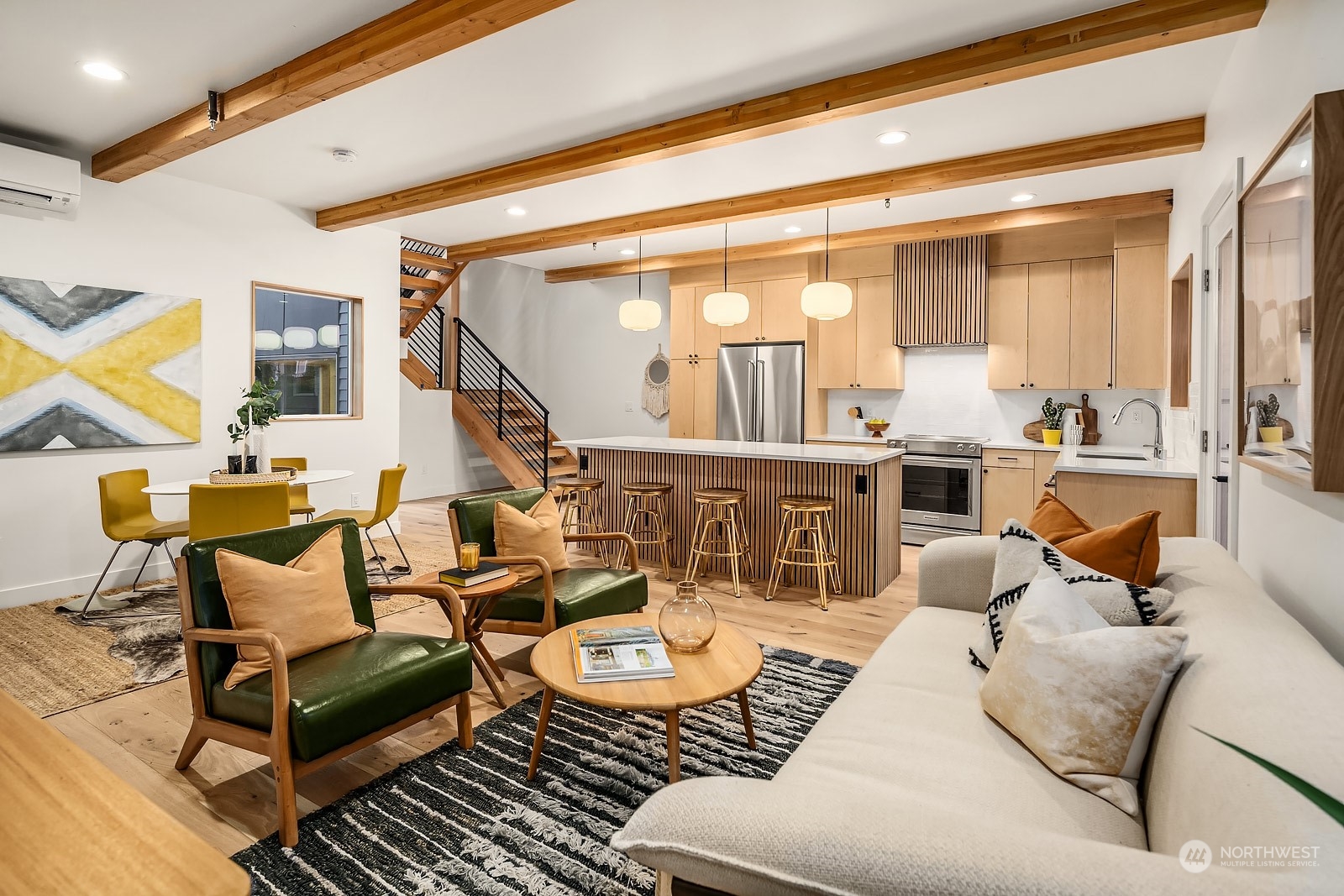 911 14th Avenue, Unit A Seattle, WA 98122 - Photo 8 of 33 a living room with furniture and a large window