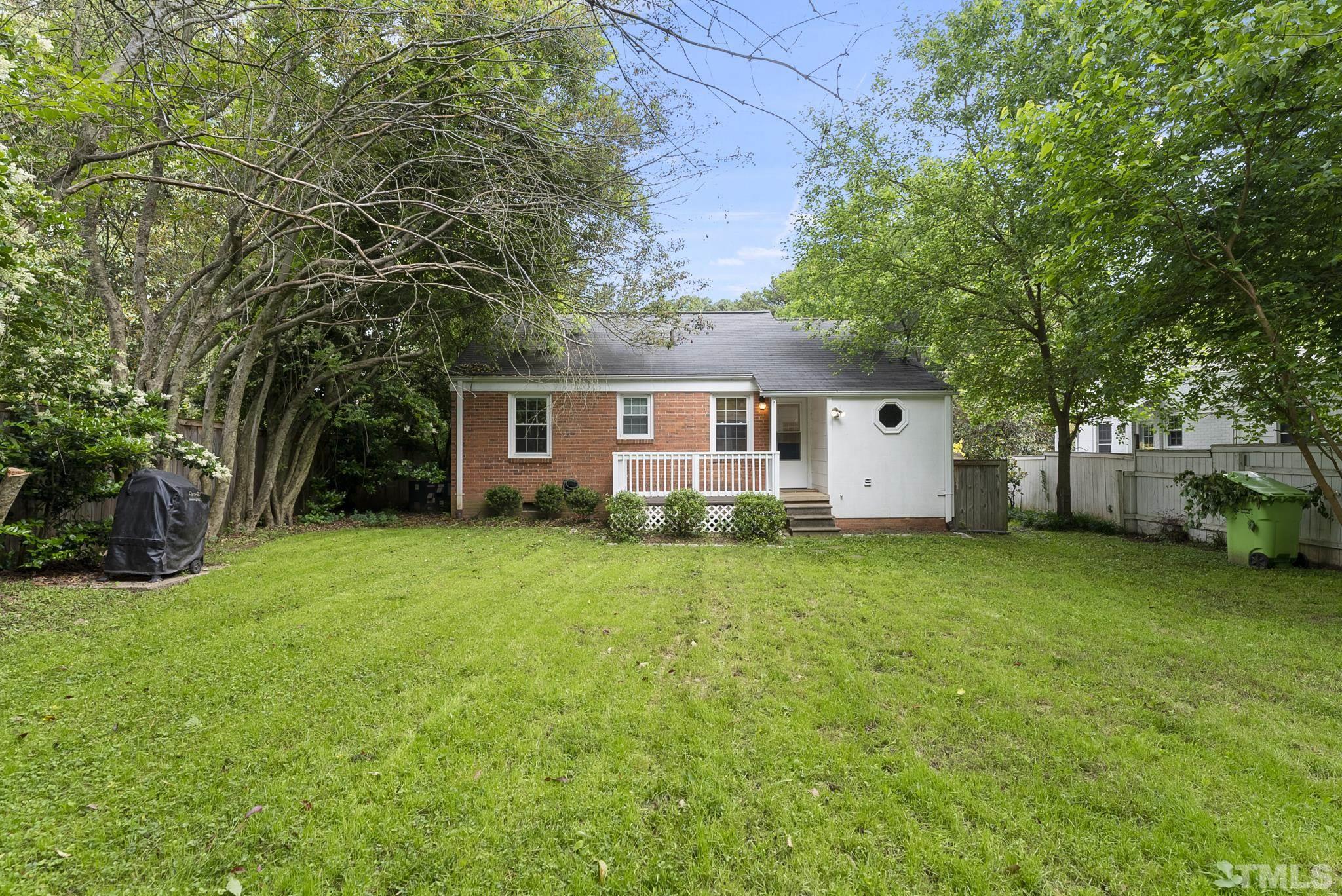 808 Young Street Raleigh, NC 27608 - Photo 18 of 26 a view of a house with backyard and garden