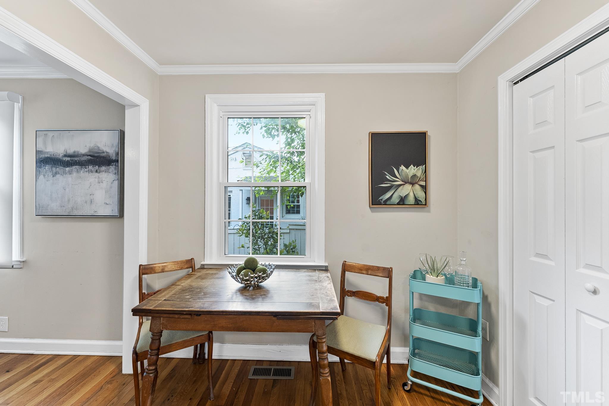 808 Young Street Raleigh, NC 27608 - Photo 7 of 26 a view of a dining room with furniture and wooden floor
