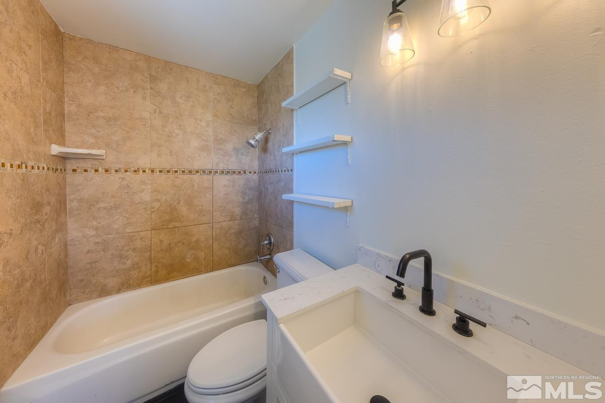 3504 Sun Cloud Circle Reno, NV 89506 - Photo 12 of 26 a bathroom with a sink toilet and shower