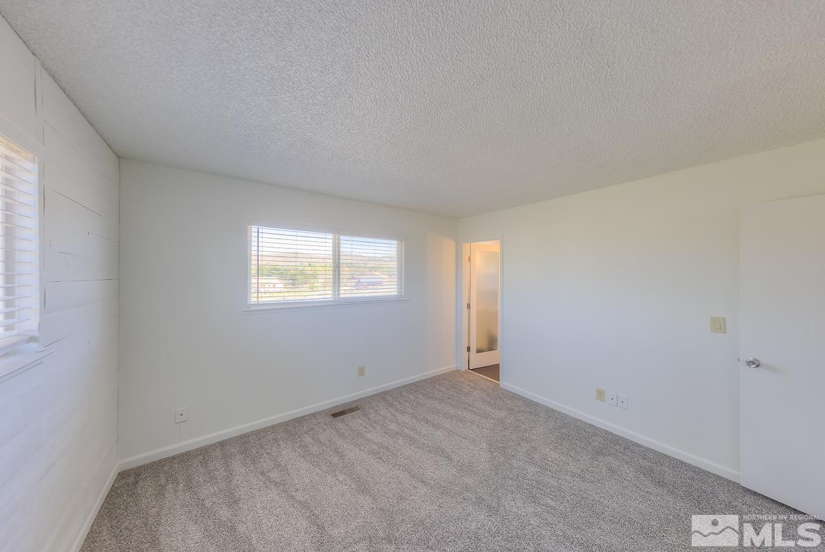 3504 Sun Cloud Circle Reno, NV 89506 - Photo 14 of 26 a view of an empty room with a window