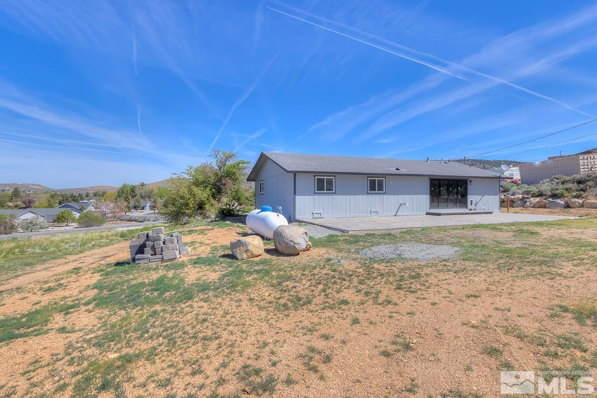 3504 Sun Cloud Circle Reno, NV 89506 - Photo 21 of 26 a backyard of a house with table and chairs