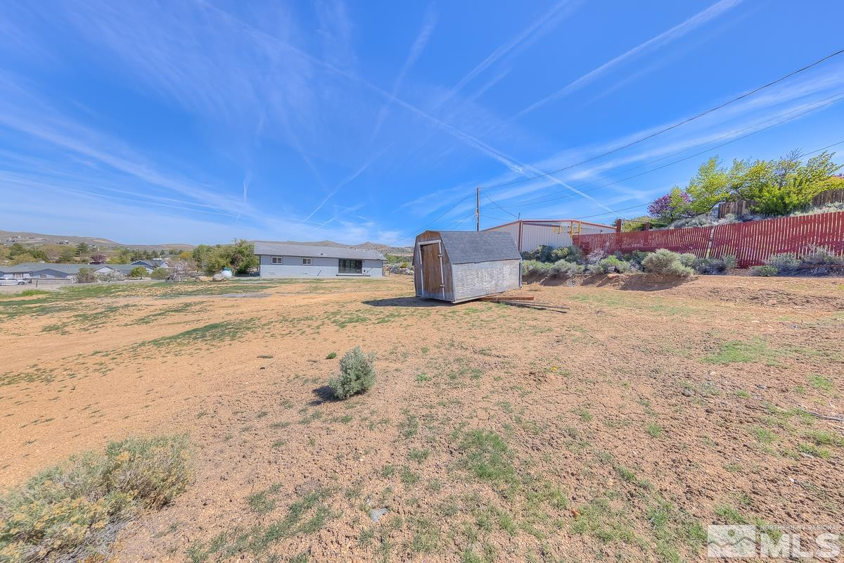 3504 Sun Cloud Circle Reno, NV 89506 - Photo 22 of 26 a view of a dry yard with wooden fence