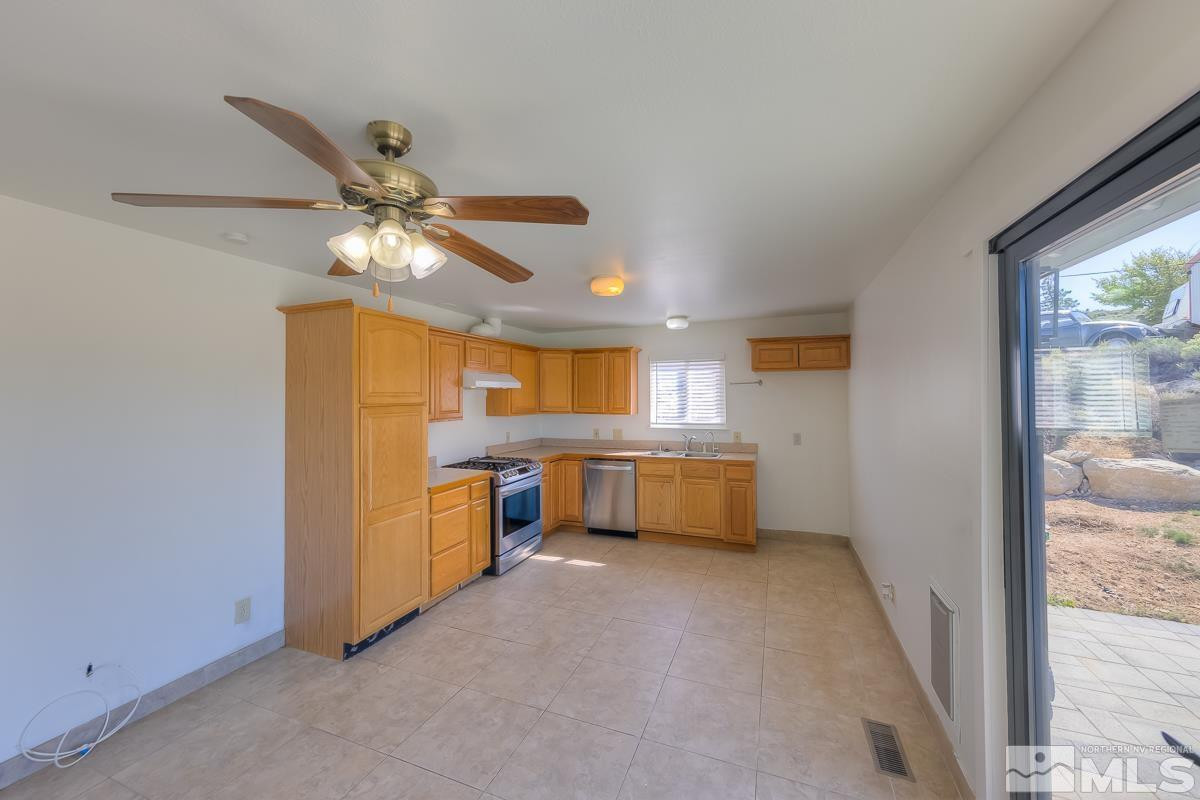 3504 Sun Cloud Circle Reno, NV 89506 - Photo 7 of 26 a view of a kitchen with a sink and a window